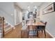 Cozy dining area with hardwood floors, stylish seating, and open access to the kitchen at 11937 Bianca Ln, Orlando, FL 32827