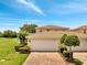 Exterior home view showing the tiled roof and well-manicured landscaping at 11937 Bianca Ln, Orlando, FL 32827