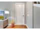 Bright foyer featuring hardwood floors, a white front door, and neutral wall paint at 11937 Bianca Ln, Orlando, FL 32827
