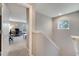 Hallway leading to home office with desk and seating area with natural light coming through the windows at 11937 Bianca Ln, Orlando, FL 32827