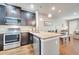 Bright kitchen featuring stainless steel appliances, granite countertops and adjacent dining area at 11937 Bianca Ln, Orlando, FL 32827