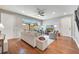 Bright and airy living room with hardwood floors, neutral decor, and access to the outdoor patio at 11937 Bianca Ln, Orlando, FL 32827