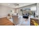 Cozy living room featuring hardwood floors, comfortable seating, and a view of the outdoor patio at 11937 Bianca Ln, Orlando, FL 32827