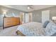 Spacious main bedroom featuring a dresser and ensuite bathroom with good natural light at 11937 Bianca Ln, Orlando, FL 32827