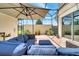 Screened in patio featuring comfortable seating and plenty of potted plants at 11937 Bianca Ln, Orlando, FL 32827