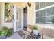 Charming outdoor patio with seating area and view of the building exterior at 11937 Bianca Ln, Orlando, FL 32827