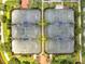 Overhead view of well-maintained tennis courts surrounded by lush greenery in a residential community at 11937 Bianca Ln, Orlando, FL 32827