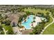 Aerial view of the vast community pool, clubhouse, landscaping, and green spaces at 13452 Sagestone Dr, Winter Garden, FL 34787