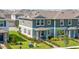 Aerial view of a townhome featuring a well-maintained yard and neatly arranged landscaping at 13452 Sagestone Dr, Winter Garden, FL 34787