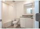 Bathroom featuring a shower-tub combo, granite-topped vanity, tile floors, and white cabinets at 13452 Sagestone Dr, Winter Garden, FL 34787