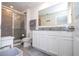 Bathroom with a glass shower, toilet, and vanity with granite countertop at 13452 Sagestone Dr, Winter Garden, FL 34787