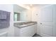 Bathroom with a double vanity, granite countertop, and ample lighting at 13452 Sagestone Dr, Winter Garden, FL 34787