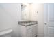 Bathroom featuring a granite-topped vanity, neutral paint, white cabinets, and modern finishes at 13452 Sagestone Dr, Winter Garden, FL 34787