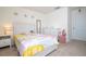 Bright bedroom features neutral carpet, colorful bedding, modern furniture and great lighting at 13452 Sagestone Dr, Winter Garden, FL 34787