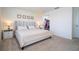 Cozy bedroom with a walk-in closet, neutral colors, and carpeted flooring at 13452 Sagestone Dr, Winter Garden, FL 34787