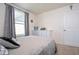 Bedroom features neutral carpet, modern furniture, and a large window with curtains at 13452 Sagestone Dr, Winter Garden, FL 34787