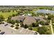 An aerial view shows the spacious clubhouse, surrounded by lush tropical landscaping at 13452 Sagestone Dr, Winter Garden, FL 34787