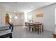 Open dining area with a wooden table, seating for six, and plenty of natural light from nearby windows at 13452 Sagestone Dr, Winter Garden, FL 34787