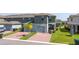 This townhome features neutral paint, a two-car garage, and a brick paver driveway at 13452 Sagestone Dr, Winter Garden, FL 34787