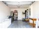 Well-lit garage featuring storage solutions and space for bikes and other equipment with a door to outside at 13452 Sagestone Dr, Winter Garden, FL 34787