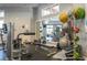 Well-equipped gym area featuring weight machines and fitness balls for a comprehensive workout at 13452 Sagestone Dr, Winter Garden, FL 34787