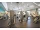 Spacious gym with multiple weight machines and mirrors, ideal for a full-body workout at 13452 Sagestone Dr, Winter Garden, FL 34787