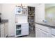 Kitchen with pantry and modern white storage at 13452 Sagestone Dr, Winter Garden, FL 34787