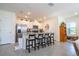 Spacious kitchen features a large island with seating, stainless steel appliances, and sleek white cabinetry at 13452 Sagestone Dr, Winter Garden, FL 34787