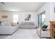Inviting living room with modern decor, neutral color palette, and lots of room at 13452 Sagestone Dr, Winter Garden, FL 34787