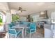 Outdoor kitchen area with stainless steel appliances and ample seating, perfect for entertaining at 13452 Sagestone Dr, Winter Garden, FL 34787