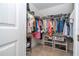 Organized walk-in closet with clothing racks and shelves for storage at 13452 Sagestone Dr, Winter Garden, FL 34787