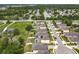 This aerial view highlights the neighborhood's green landscaping and road layout at 13842 Pickett Reserve Ct, Orlando, FL 32826