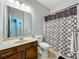 Neutral toned bathroom featuring vanity with solid surface counter, tile floor and shower/tub at 13842 Pickett Reserve Ct, Orlando, FL 32826