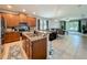 Open kitchen featuring stainless steel appliances, granite countertops, and seamless access to the living spaces at 13842 Pickett Reserve Ct, Orlando, FL 32826