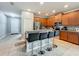 Modern kitchen features a large island with bar seating, stainless steel appliances, and ample cabinet space at 13842 Pickett Reserve Ct, Orlando, FL 32826