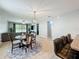 Open-concept space with views of the living room, dining area, and breakfast bar, perfect for entertaining at 13842 Pickett Reserve Ct, Orlando, FL 32826