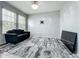 A modern living room featuring neutral walls, hardwood floors and plenty of natural light at 13842 Pickett Reserve Ct, Orlando, FL 32826
