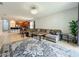 Spacious living room with natural light, decorative rug, and comfortable seating at 13842 Pickett Reserve Ct, Orlando, FL 32826