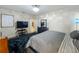 Comfortable main bedroom with modern furnishings and an open doorway leading to another room at 13842 Pickett Reserve Ct, Orlando, FL 32826