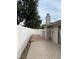 Expansive backyard featuring a paved patio, white vinyl fence and mature trees, ideal for outdoor living at 1422 Spalding Rd, Winter Springs, FL 32708