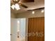Bright bedroom features a ceiling fan, track lighting and closet space at 1422 Spalding Rd, Winter Springs, FL 32708