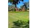 Elegant neighborhood entrance featuring brick columns and manicured landscaping at 1422 Spalding Rd, Winter Springs, FL 32708