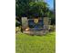 Welcoming neighborhood entrance with stone pillars and lush landscaping at 1422 Spalding Rd, Winter Springs, FL 32708