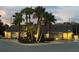 The building's exterior is enhanced by manicured landscaping, including palm trees at 1422 Spalding Rd, Winter Springs, FL 32708