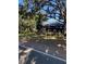 Home exterior showcasing mature trees in the front yard at 1422 Spalding Rd, Winter Springs, FL 32708