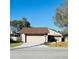 Inviting single-Gathering home featuring a two-car garage and manicured lawn at 1422 Spalding Rd, Winter Springs, FL 32708