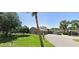 Exterior view of a building with landscaping including palm trees and a well-maintained lawn at 1422 Spalding Rd, Winter Springs, FL 32708