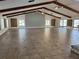 Bright and airy great room featuring exposed beams, tile floors, and abundant windows at 1422 Spalding Rd, Winter Springs, FL 32708