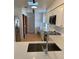Newly remodeled kitchen featuring stainless steel appliances, granite countertops, and white cabinetry at 1422 Spalding Rd, Winter Springs, FL 32708