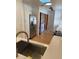 Modern kitchen featuring a stainless steel sink, faucet, appliances and quartz countertops at 1422 Spalding Rd, Winter Springs, FL 32708